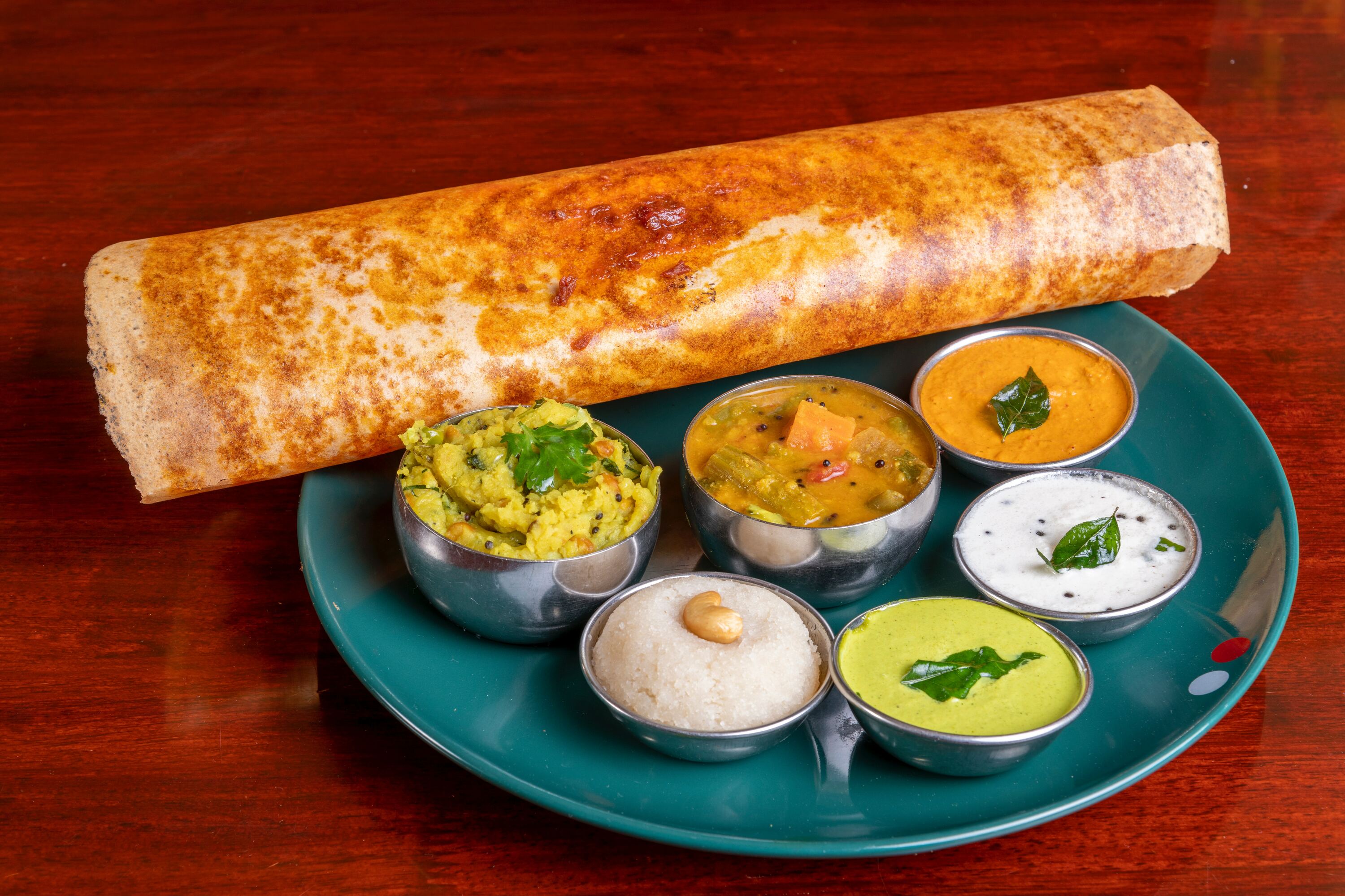 Typisch für die südindische Küche: Dosas sind knusprige, dünne Pfannkuchen aus Reis- und Linsenmehl / ©Unsplash / Deepal Tamang