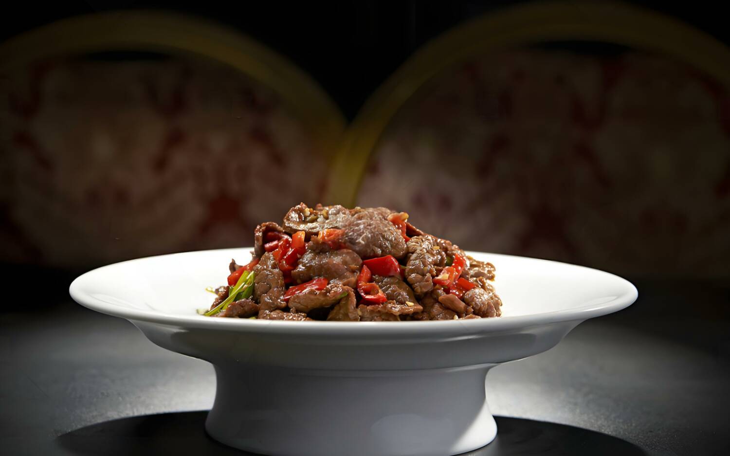 Aus Hunan stammt dieses mit zwei Paprikasorten gewürzte Rindfleisch-Wokgericht/ ©Chuan-Heritage